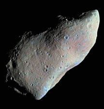 The image is a false color view of the asteroid 951 Gaspra taken by the Galileo spacecraft