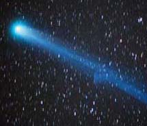 A picture of the comet Hyakutake, passing across the handle of the Big Dipper on March 25, 1996