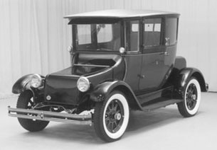 In 1907 the Anderson Carriage Company produced their first electric car, which was rated at 80 miles per charge with the record of over 211 miles on one charge