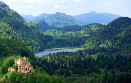 Bavarian German countryside, with a view of a Castle in the Alps